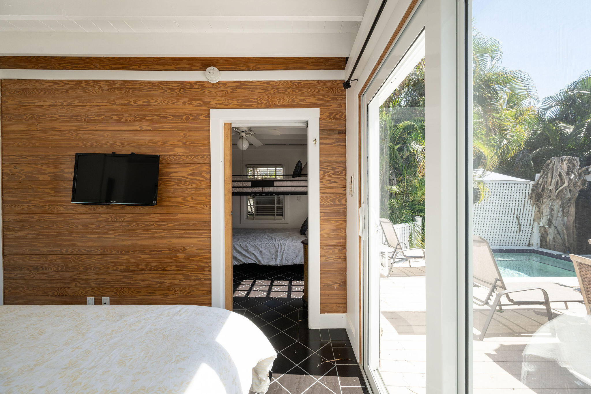 912 James Street, Unit 2 Key West, FL 33040 - Photo 21 of 25 a en suite bathroom with a sink a mirror and a shower