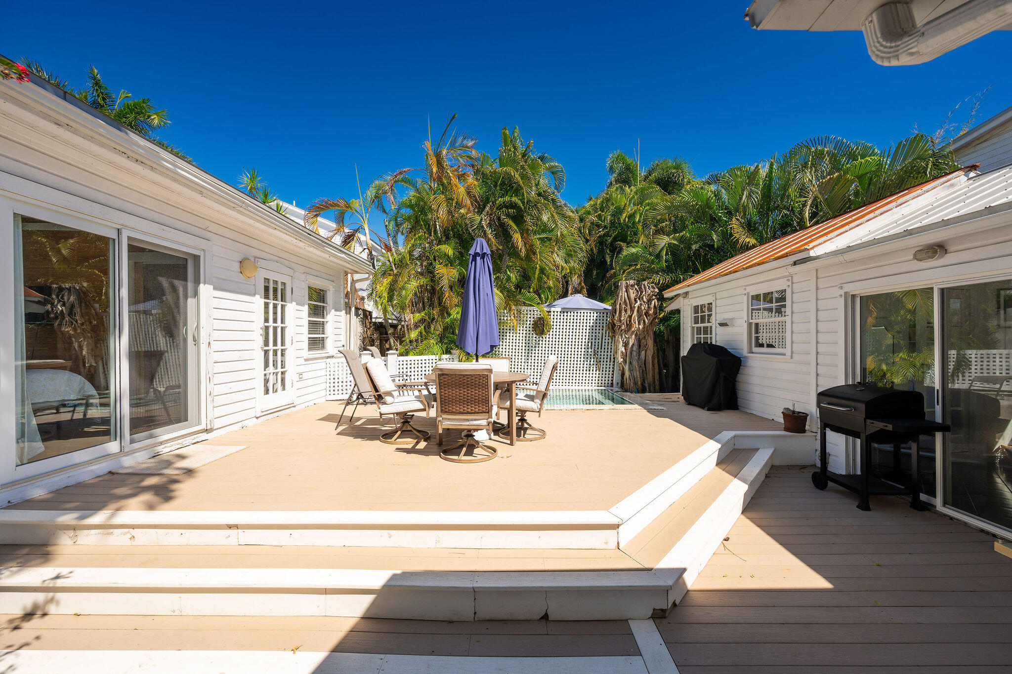 912 James Street, Unit 2 Key West, FL 33040 - Photo 6 of 25 a view of a house with backyard sitting area and garden