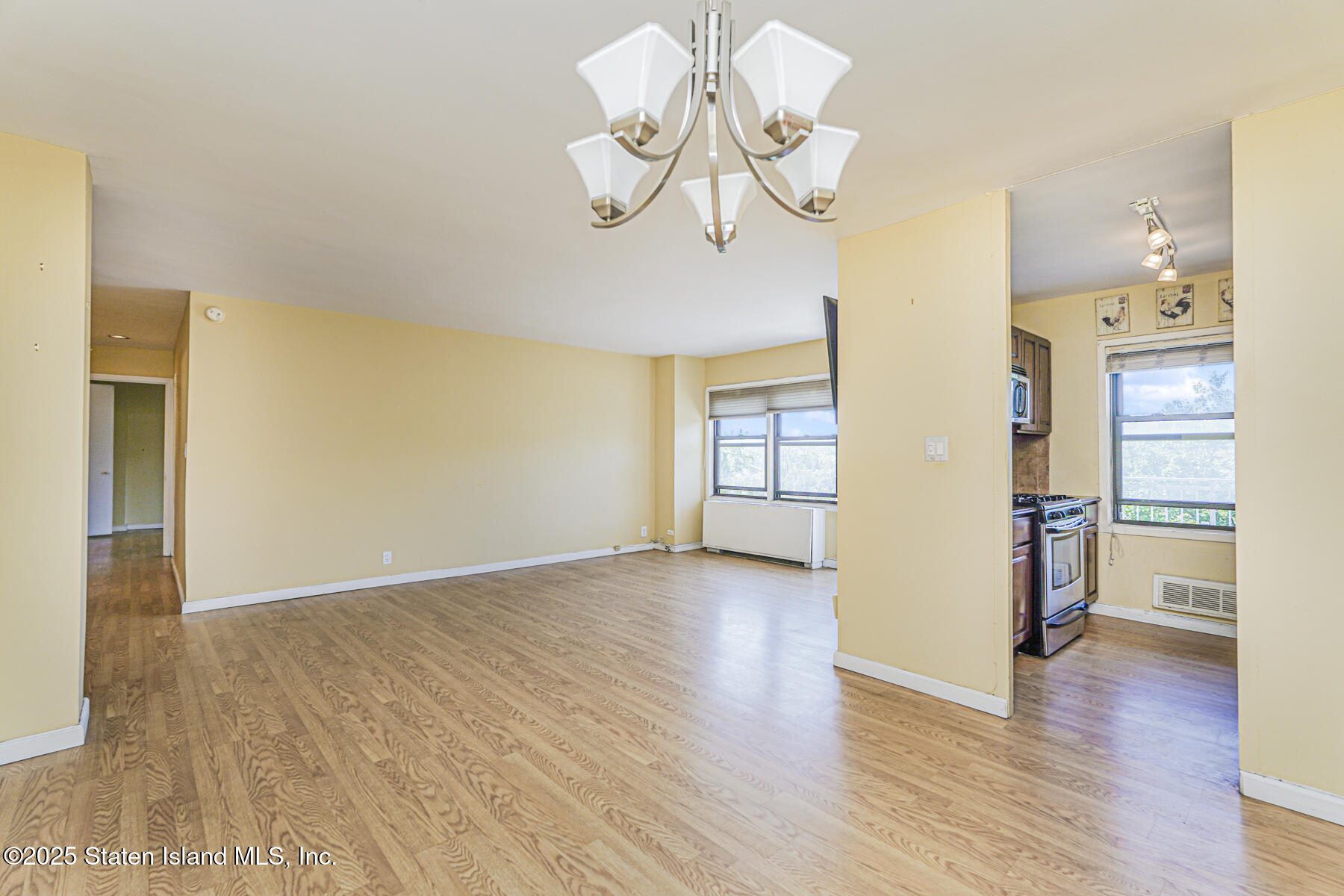 1100 Clove Road, Unit 60 Staten Island, NY 10301 - Photo 12 of 25 a view of an empty room with wooden floor