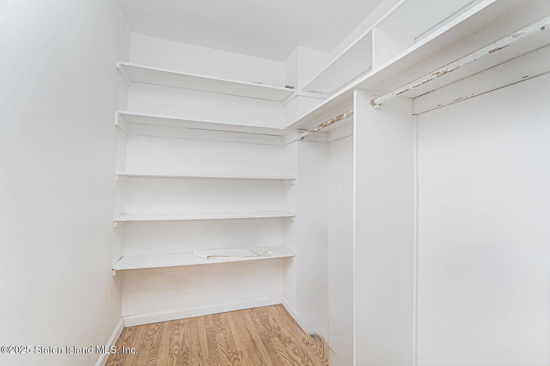 1100 Clove Road, Unit 60 Staten Island, NY 10301 - Photo 21 of 25 a view of a room with shelf