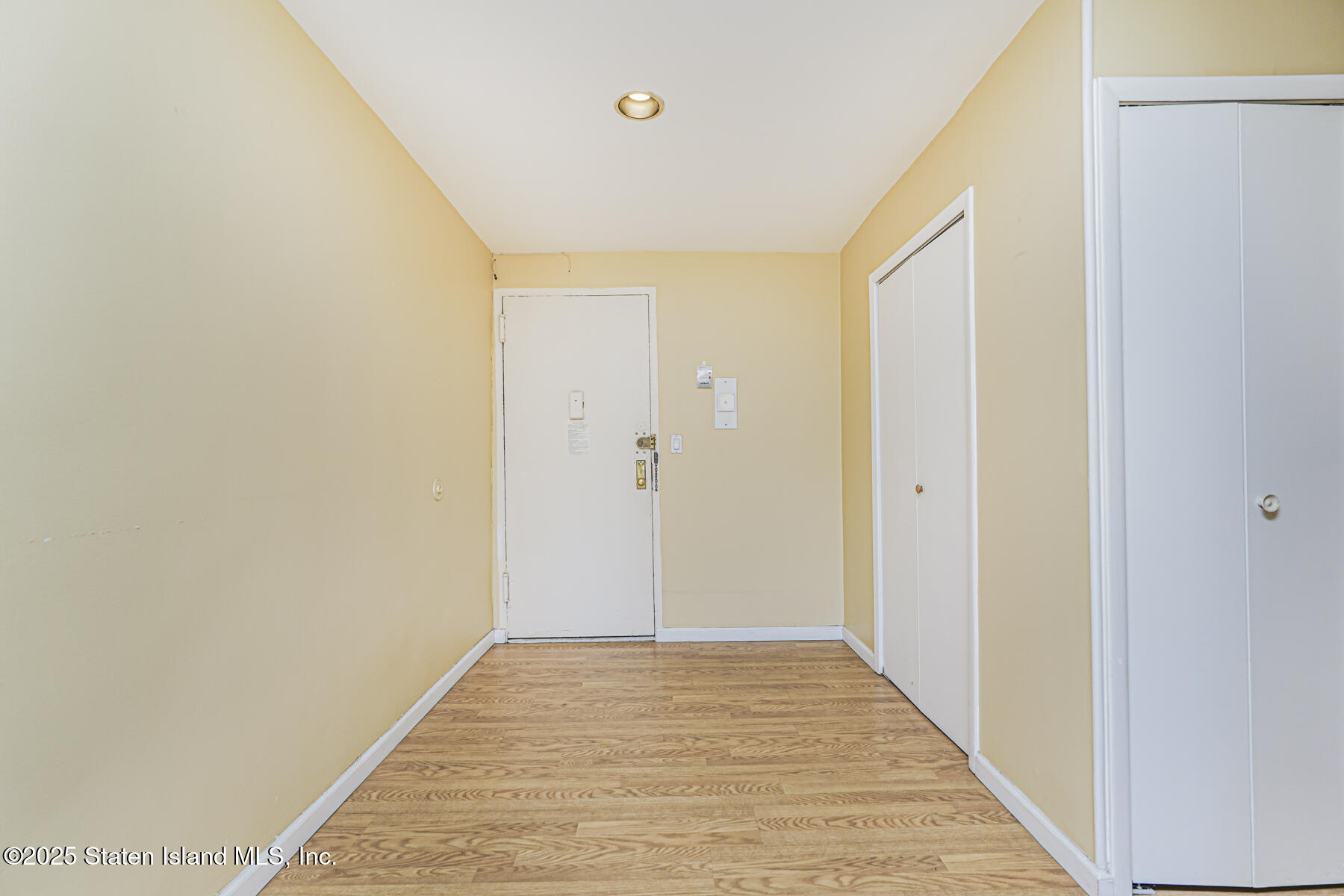 1100 Clove Road, Unit 60 Staten Island, NY 10301 - Photo 3 of 25 a view of a hallway with wooden floor