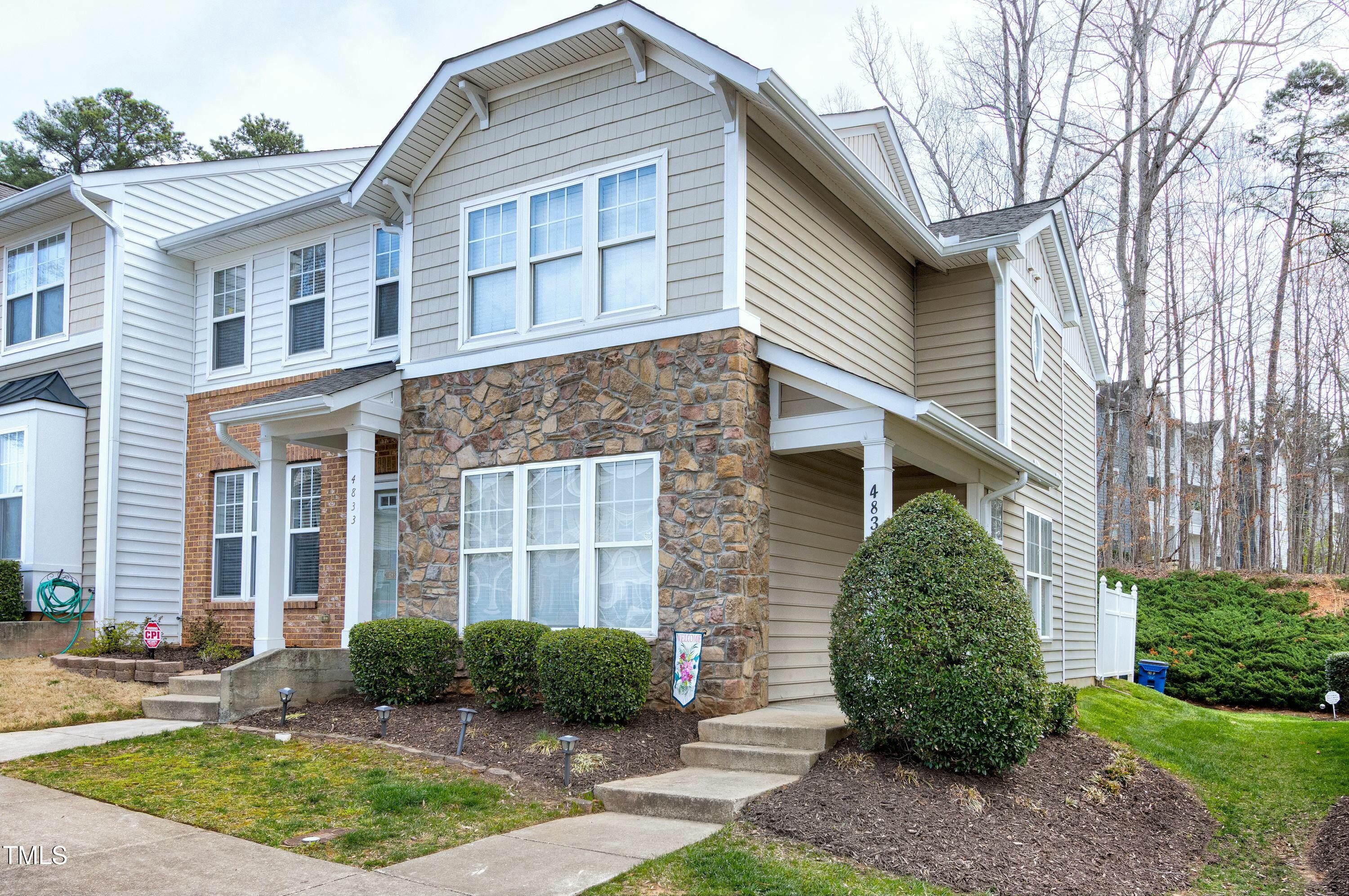 4835 Sir Duncan Way Raleigh, NC 27612 - Photo 1 of 30 a front view of a house with garden