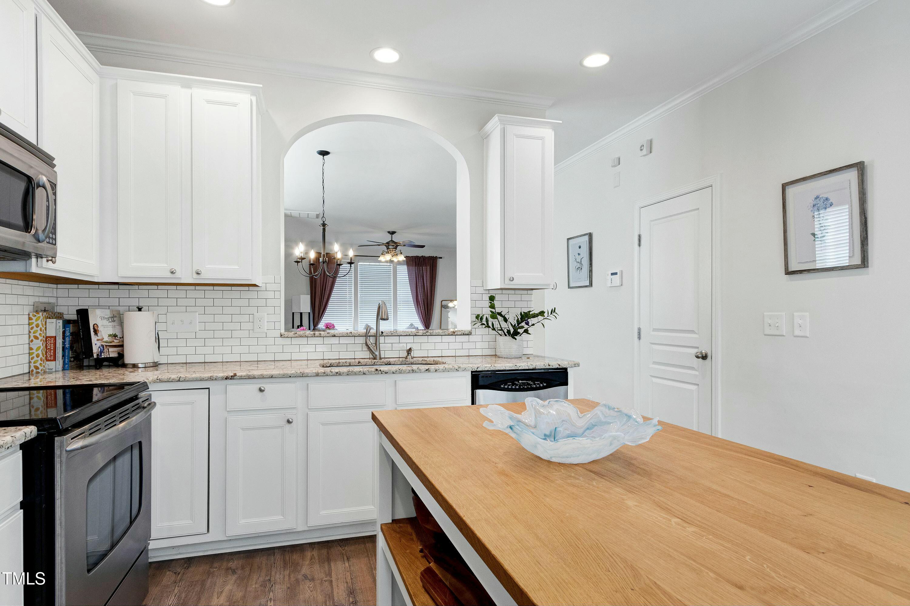 4835 Sir Duncan Way Raleigh, NC 27612 - Photo 12 of 30 a kitchen with a sink and cabinets
