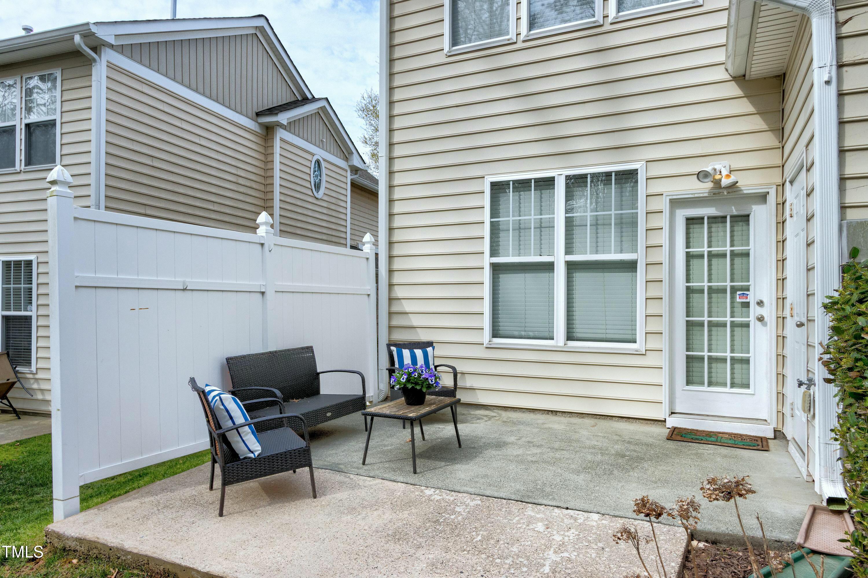 4835 Sir Duncan Way Raleigh, NC 27612 - Photo 26 of 30 a view of a house with chairs and a yard