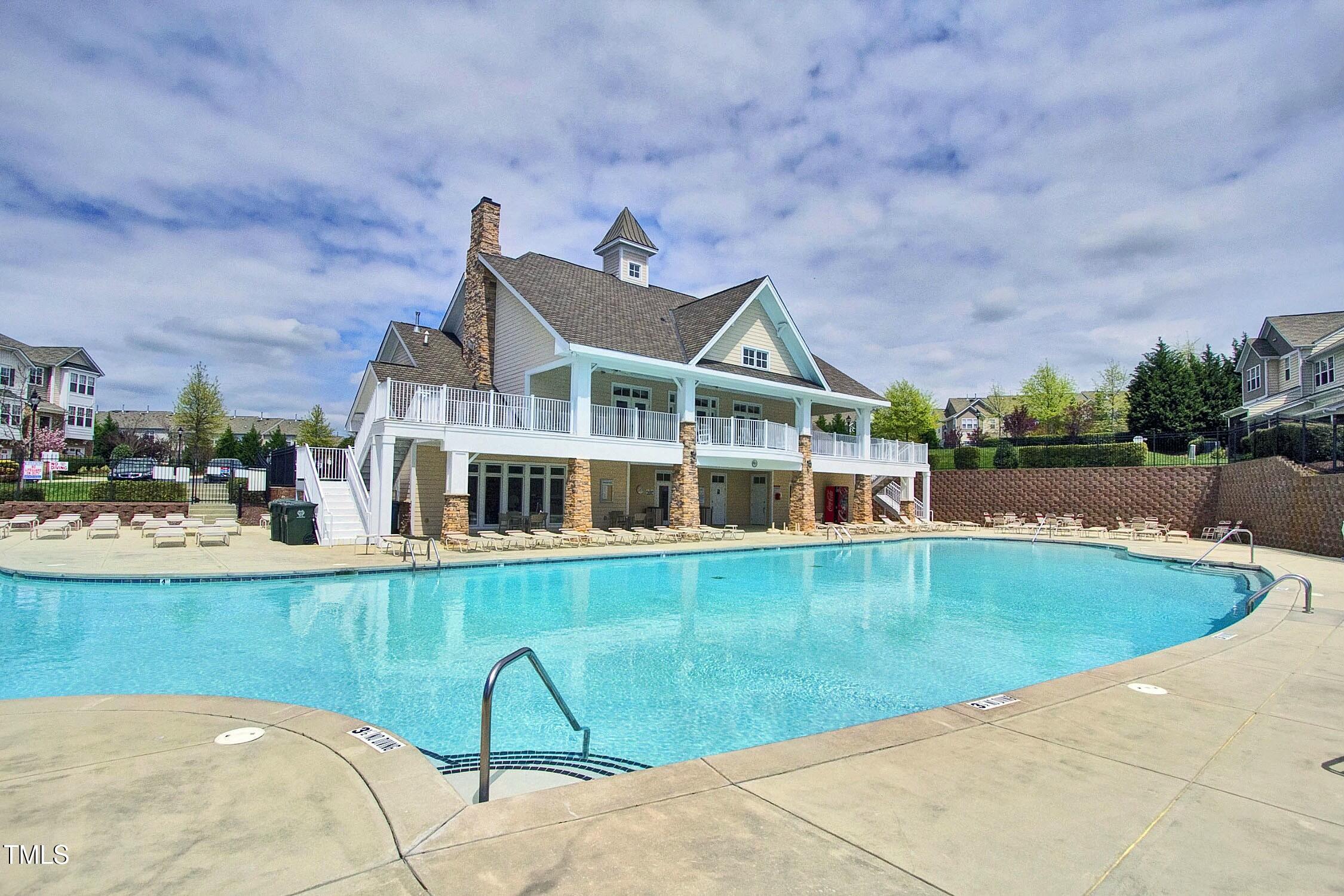 4835 Sir Duncan Way Raleigh, NC 27612 - Photo 27 of 30 a view of a house with pool and a yard