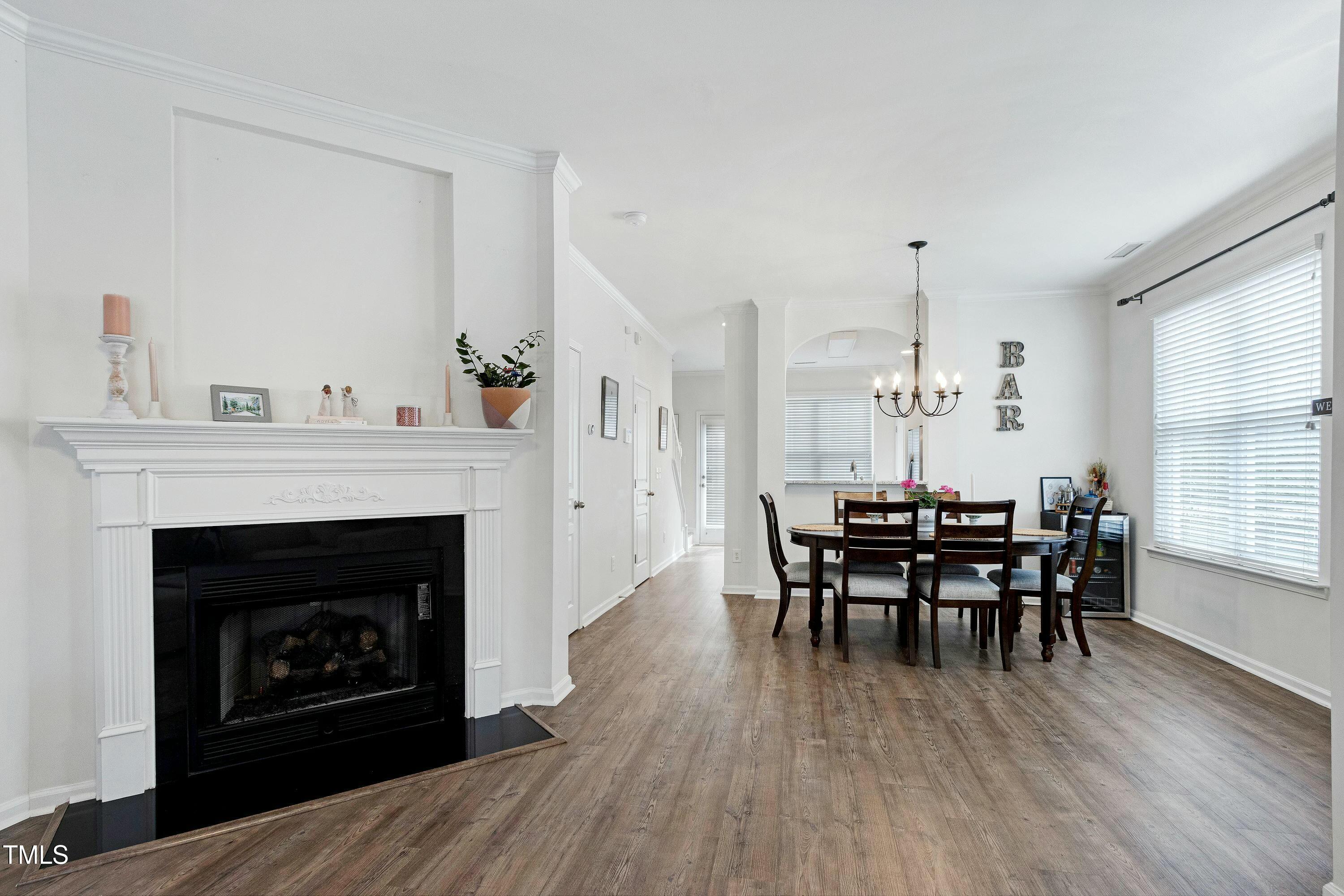 4835 Sir Duncan Way Raleigh, NC 27612 - Photo 5 of 30 a dining room with furniture and wooden floor
