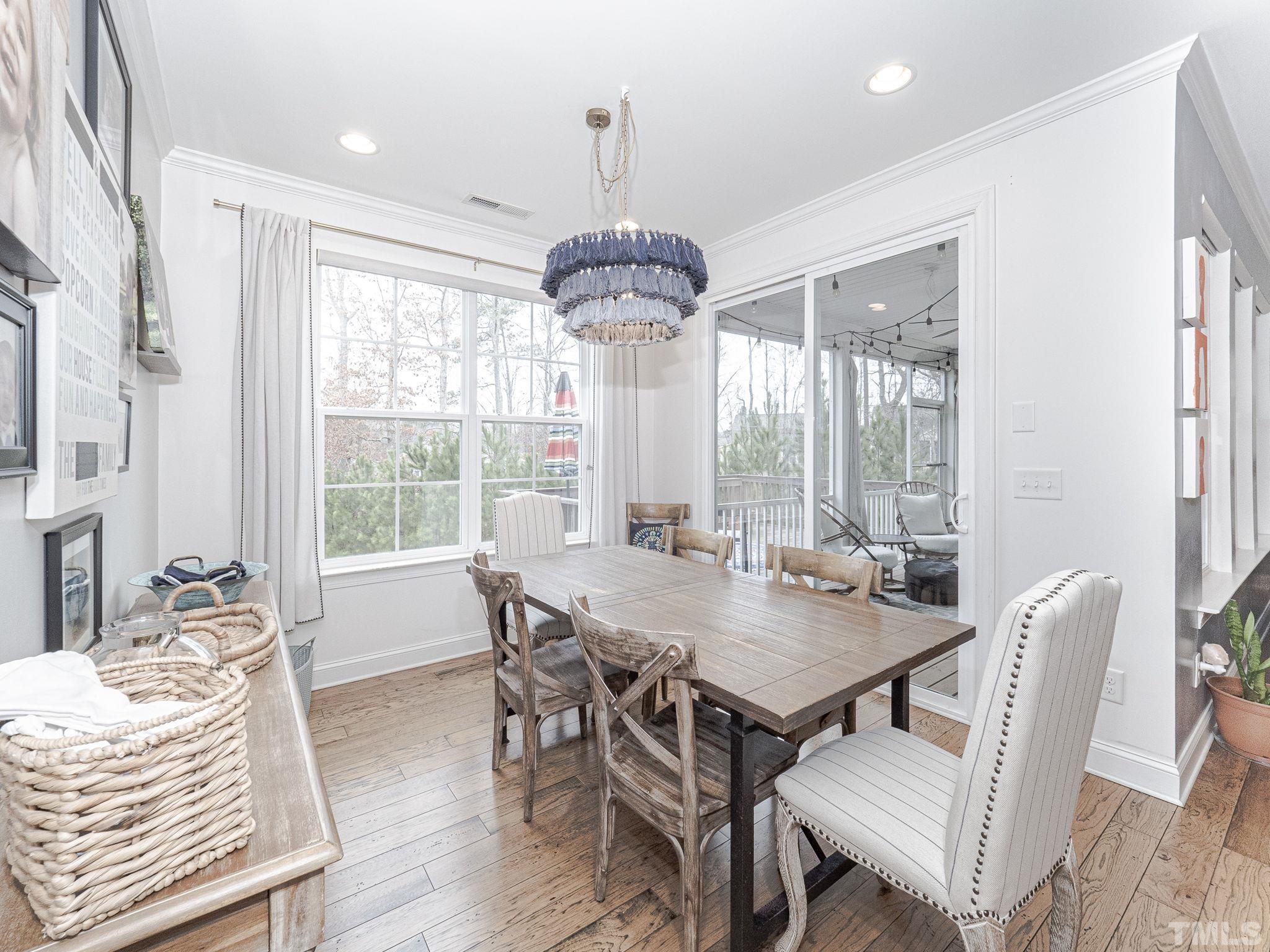 1990 Mostyn Lane Apex, NC 27502 - Photo 14 of 41 a view of a dining room with furniture window and outside view