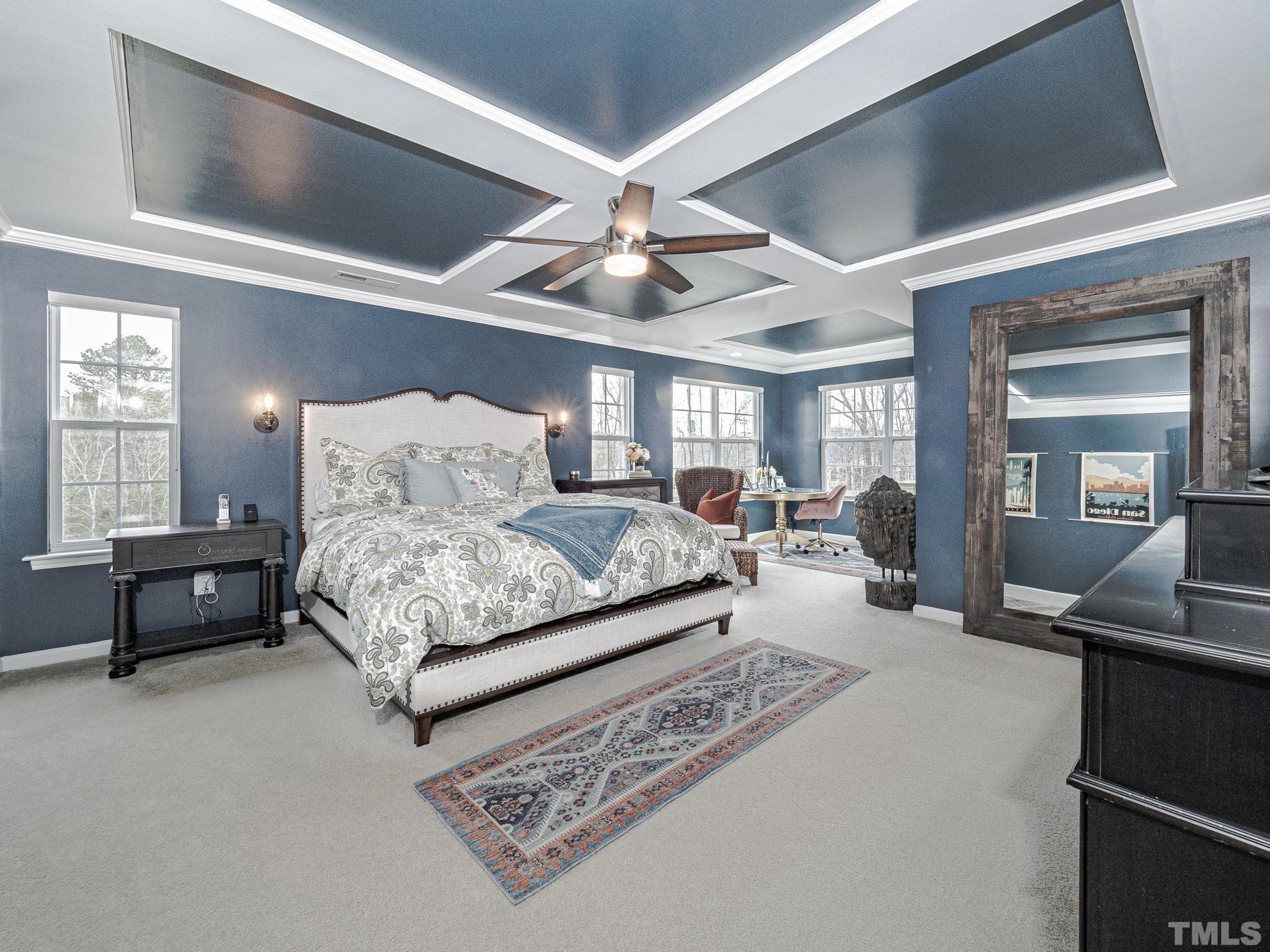 1990 Mostyn Lane Apex, NC 27502 - Photo 23 of 41 a bedroom with a bed a couch and dresser