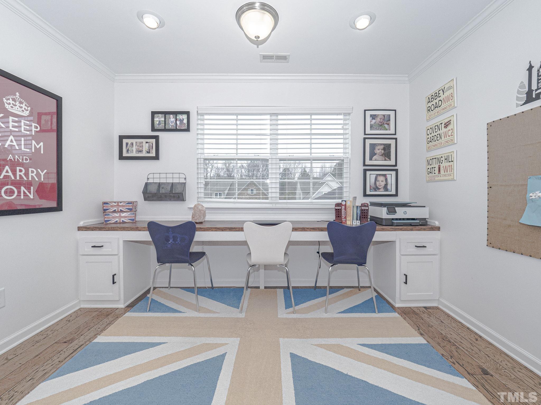 1990 Mostyn Lane Apex, NC 27502 - Photo 28 of 41 a living room with furniture and a large window