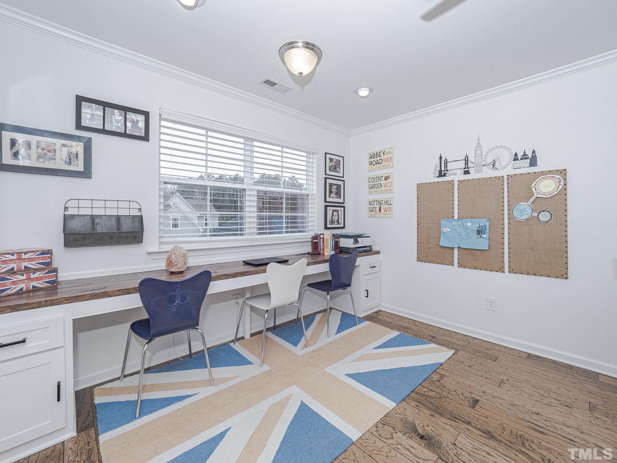 1990 Mostyn Lane Apex, NC 27502 - Photo 32 of 41 a living room with furniture and a window