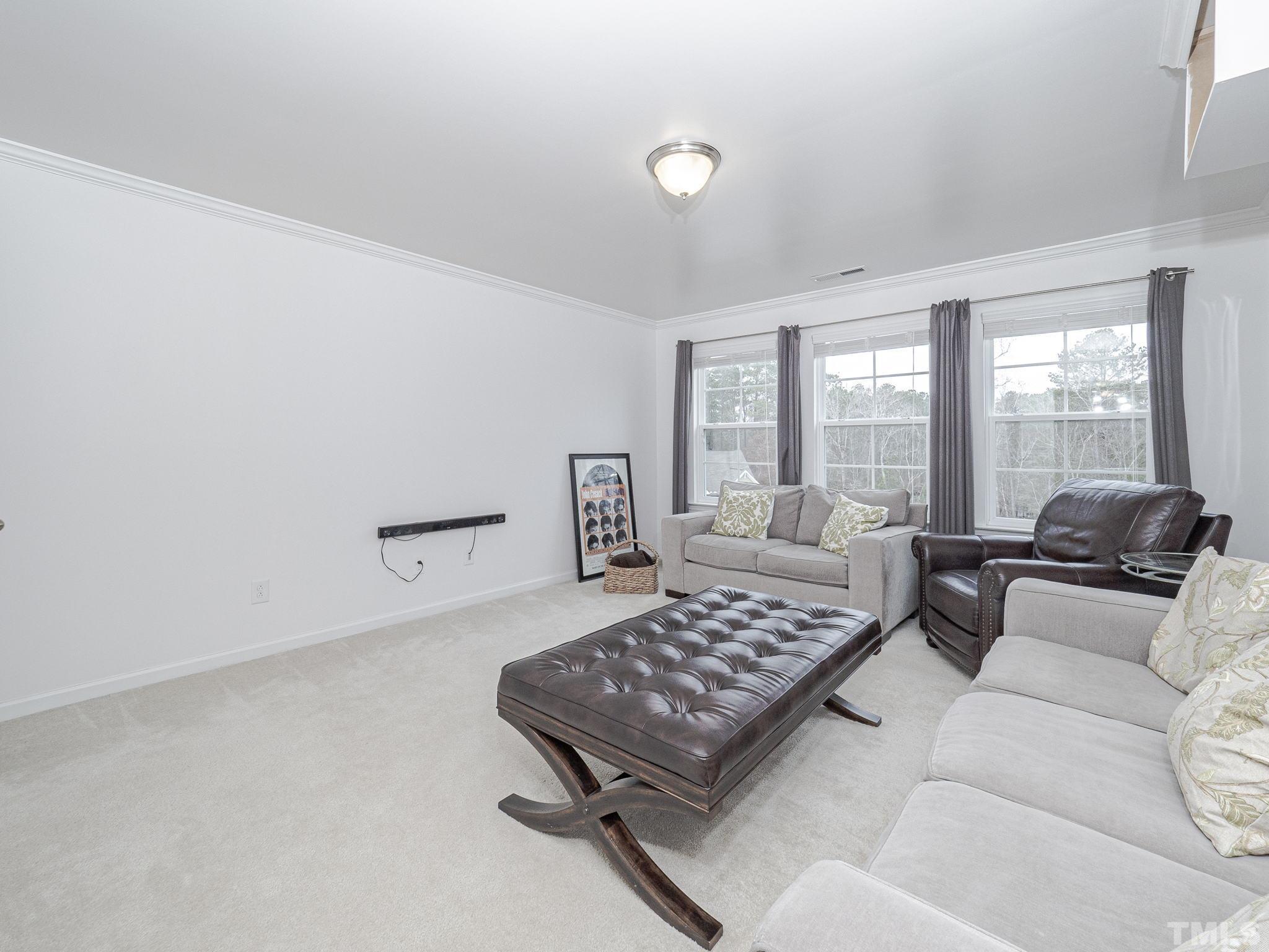 1990 Mostyn Lane Apex, NC 27502 - Photo 36 of 41 a living room with furniture rug and window