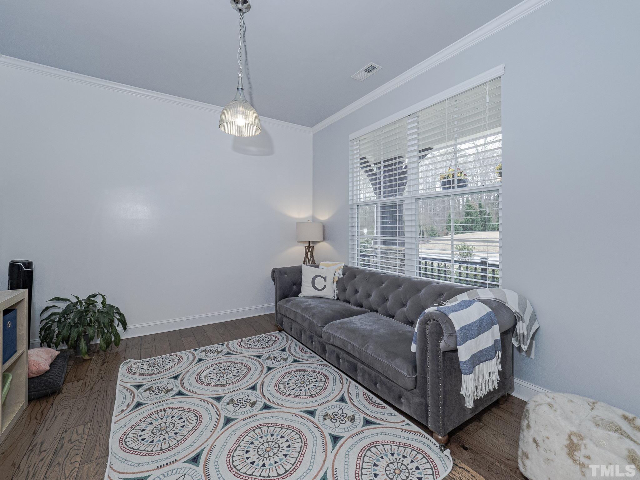 1990 Mostyn Lane Apex, NC 27502 - Photo 6 of 41 a living room with furniture and a window