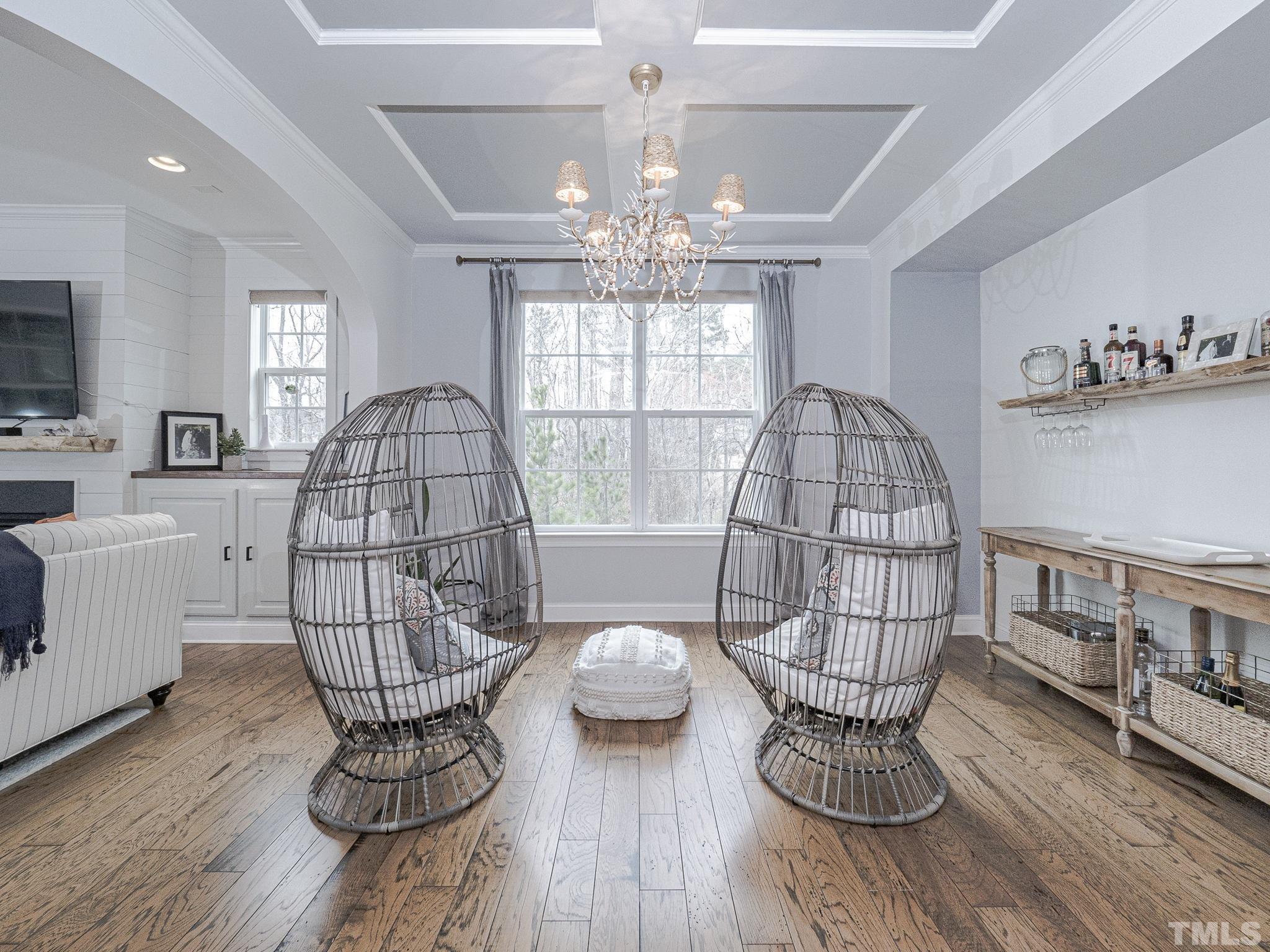 1990 Mostyn Lane Apex, NC 27502 - Photo 8 of 41 a living room with furniture chandelier and a window