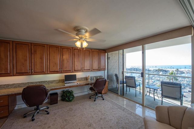 a workspace with furniture and a window