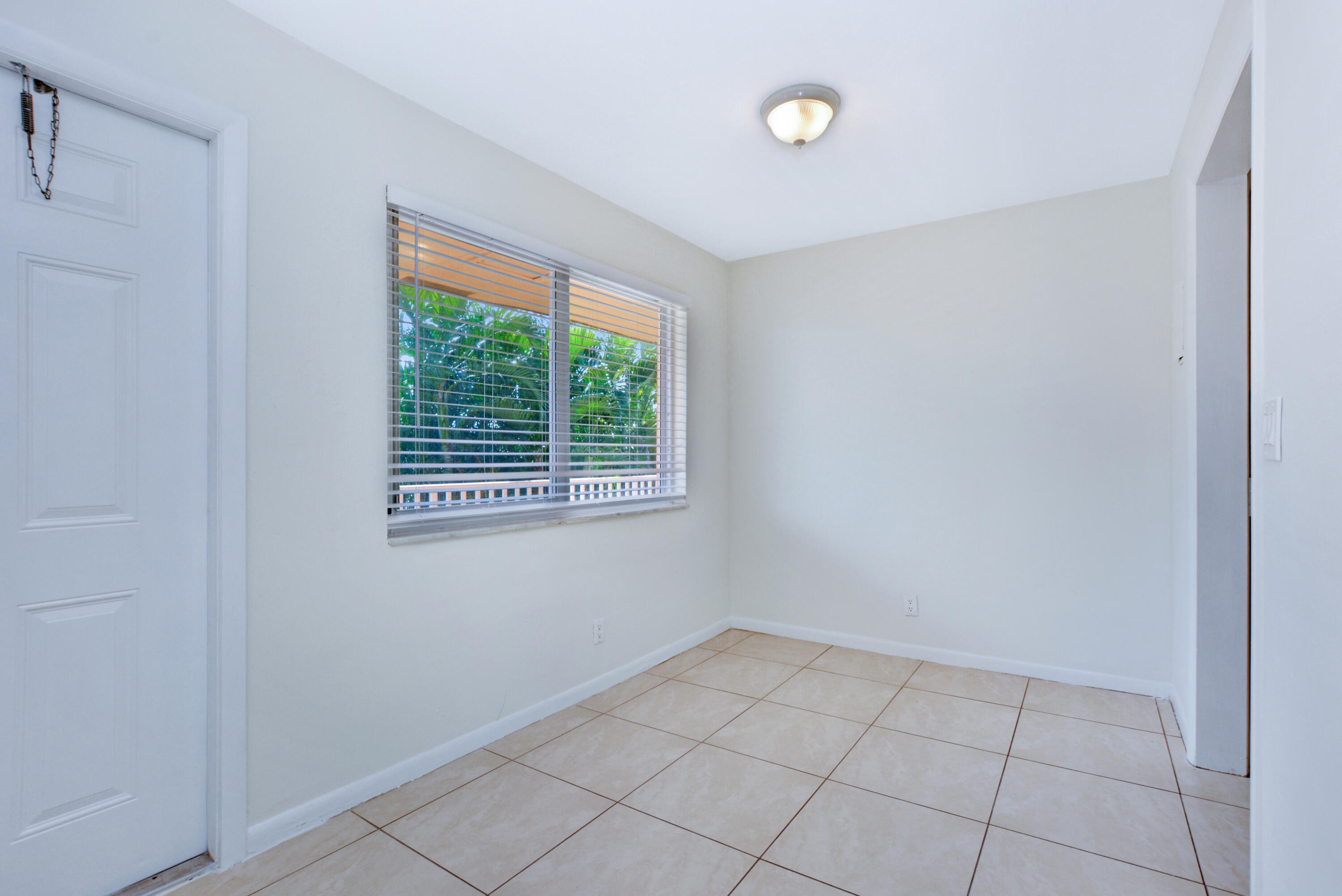 1000 Northeast 9th Avenue, Unit 8 Delray Beach, FL 33483 - Photo 3 of 10 a view of an empty room with a window