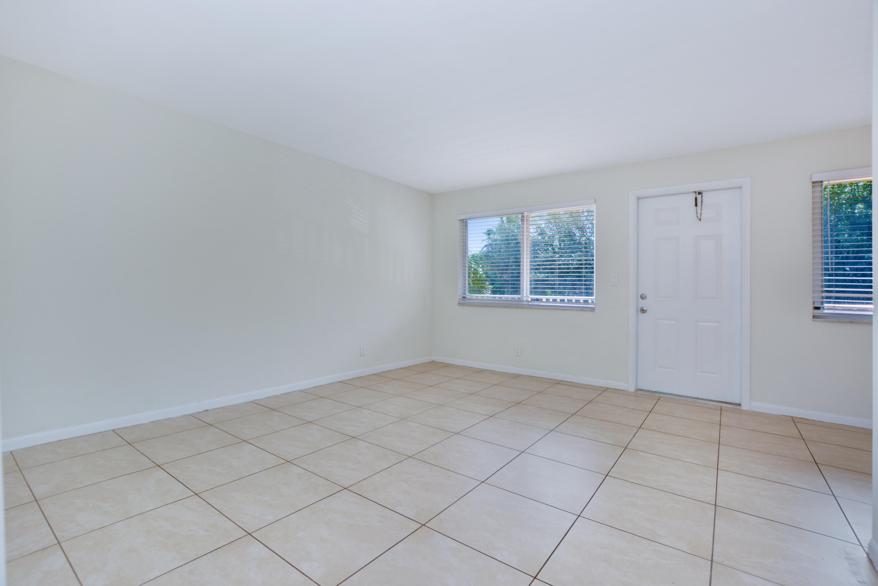 1000 Northeast 9th Avenue, Unit 8 Delray Beach, FL 33483 - Photo 7 of 10 an empty room with windows