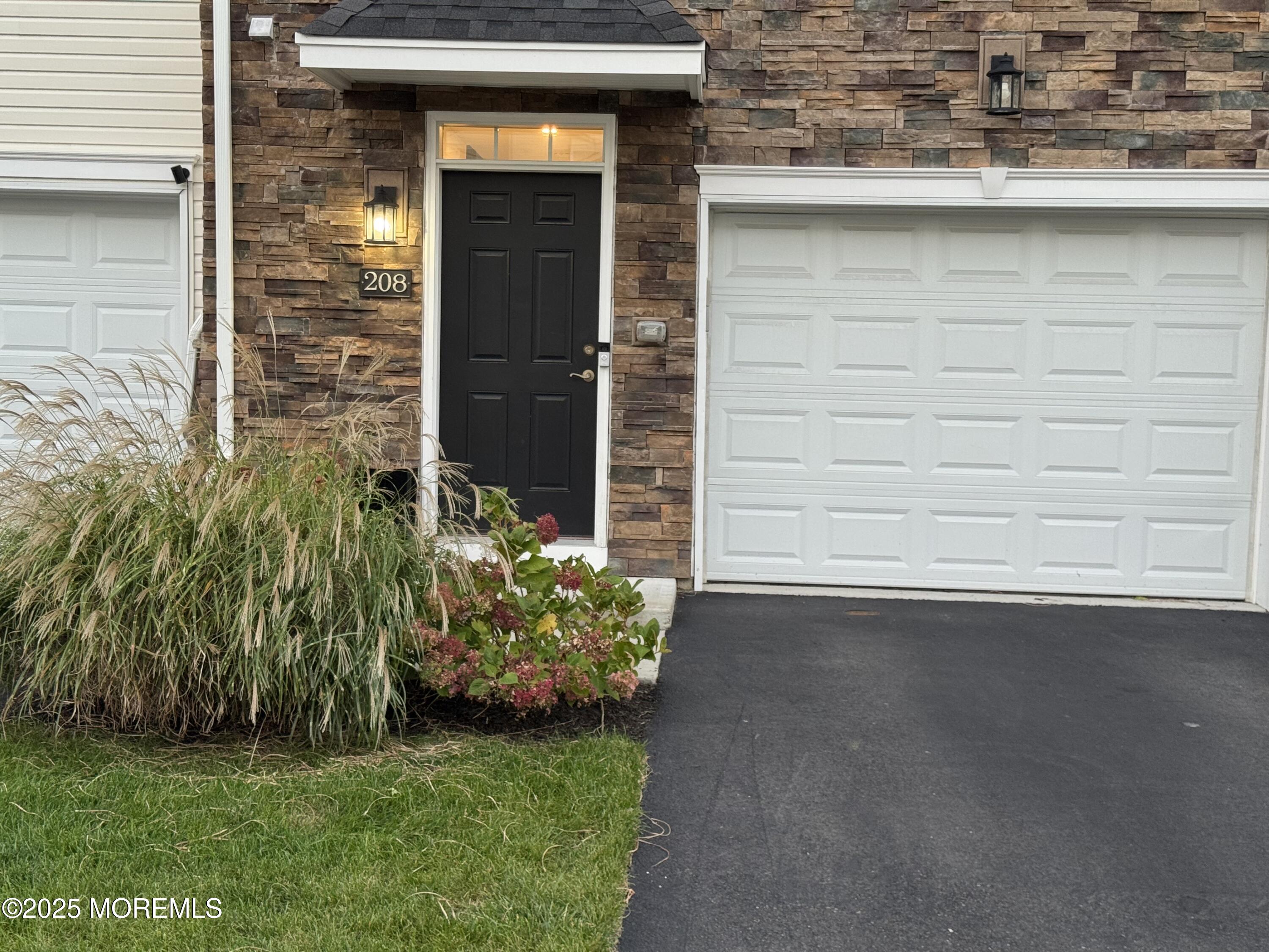 208 Revival Road Brick, NJ 08723 - Photo 21 of 24 a couple of potted plants in front of door