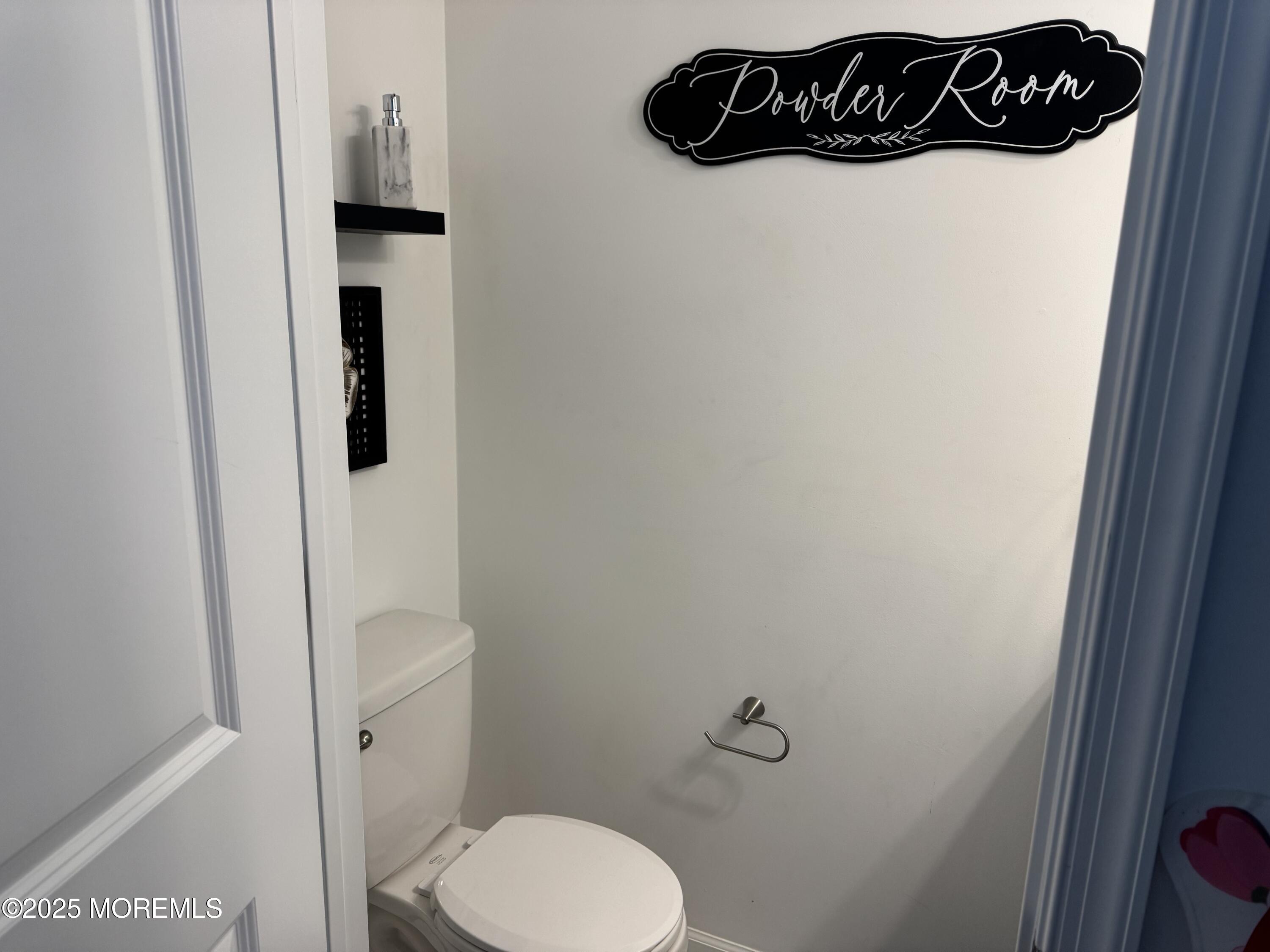 208 Revival Road Brick, NJ 08723 - Photo 10 of 24 a bathroom with a sink and toilet