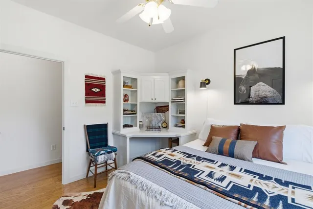 a bedroom with furniture and a chandelier