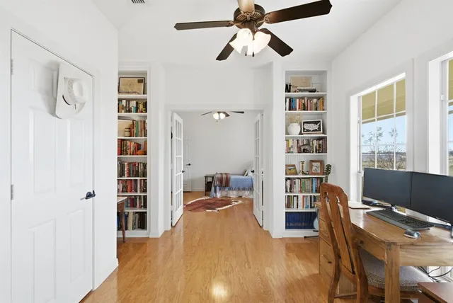 a bedroom with furniture and a window