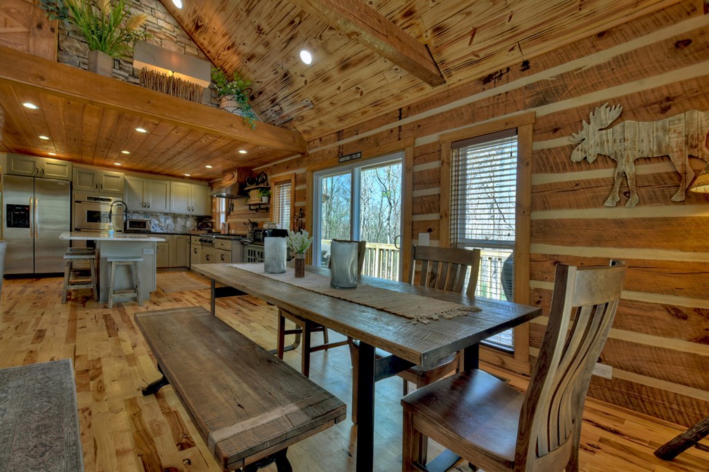 1276 Timber Lake Road Blue Ridge, GA 30513 - Photo 19 of 50 a view of a dining room with furniture window and wooden floor