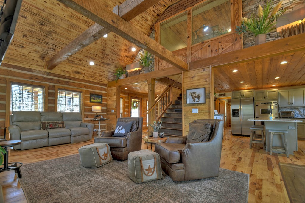 1276 Timber Lake Road Blue Ridge, GA 30513 - Photo 20 of 50 a living room with furniture and a large window