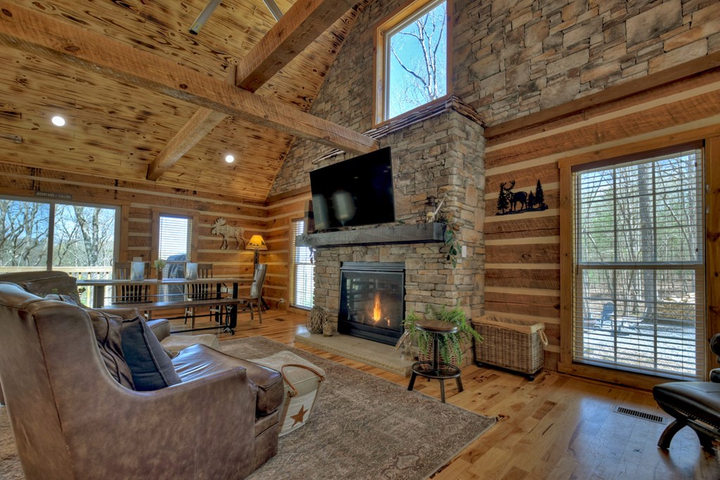 1276 Timber Lake Road Blue Ridge, GA 30513 - Photo 22 of 50 a living room with furniture and a fireplace