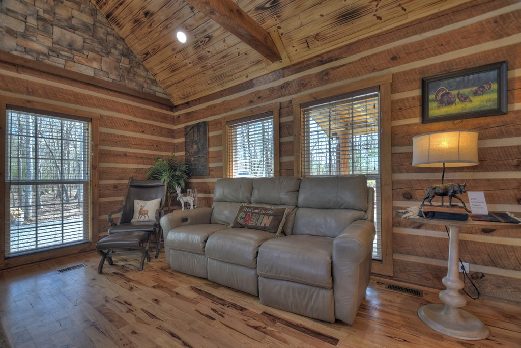 1276 Timber Lake Road Blue Ridge, GA 30513 - Photo 23 of 50 a living room with furniture and a flat screen tv