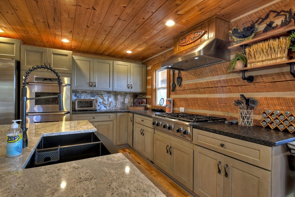 1276 Timber Lake Road Blue Ridge, GA 30513 - Photo 28 of 50 a kitchen with sink cabinets and stainless steel appliances