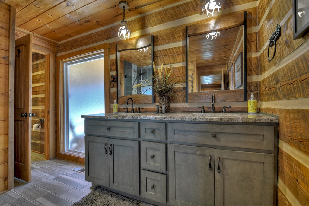 1276 Timber Lake Road Blue Ridge, GA 30513 - Photo 34 of 50 a bathroom with a granite countertop sink vanity and mirror