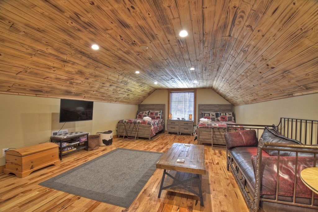 1276 Timber Lake Road Blue Ridge, GA 30513 - Photo 37 of 50 a living room with furniture and a flat screen tv
