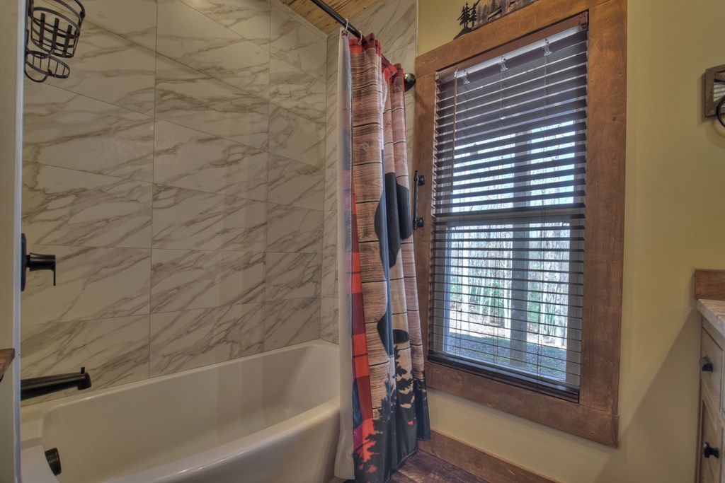 1276 Timber Lake Road Blue Ridge, GA 30513 - Photo 50 of 50 a bathroom with a bathtub and a shower
