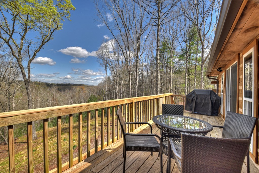 1276 Timber Lake Road Blue Ridge, GA 30513 - Photo 9 of 50 a view of balcony with a table and chairs
