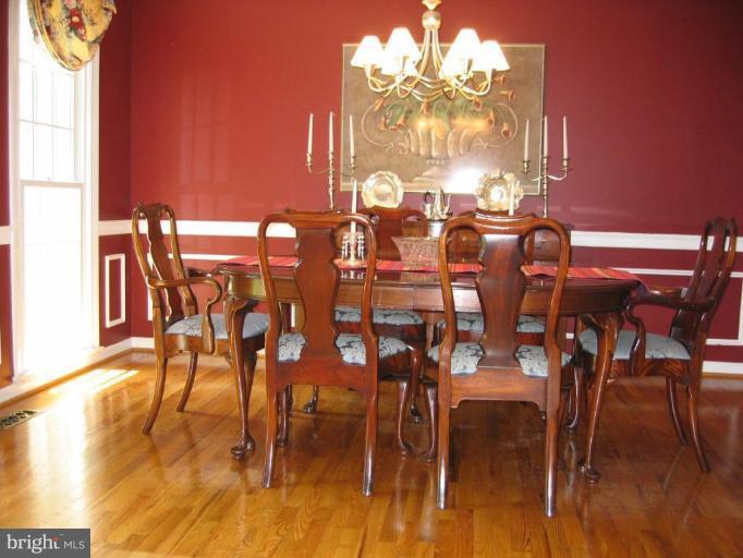 909 Riva Ridge Drive Great Falls, VA 22066 - Photo 3 of 24 Polished wood floors in gracious dining room