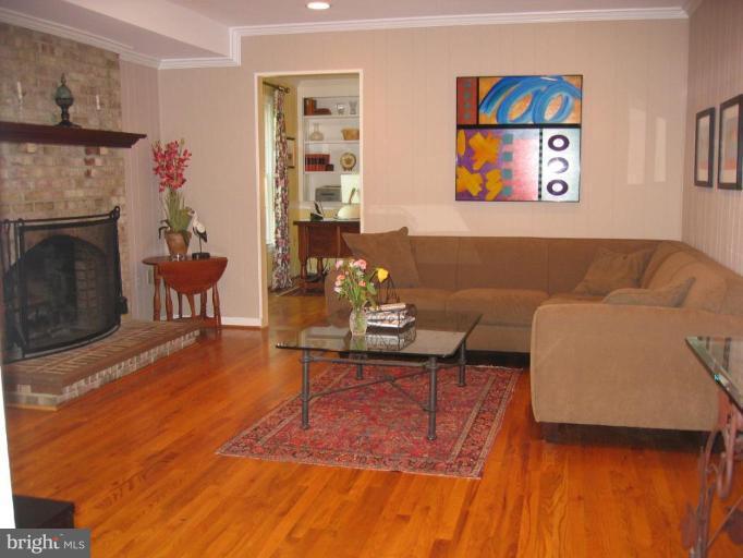 909 Riva Ridge Drive Great Falls, VA 22066 - Photo 7 of 24 Comfortable family room w/wood burning fireplace