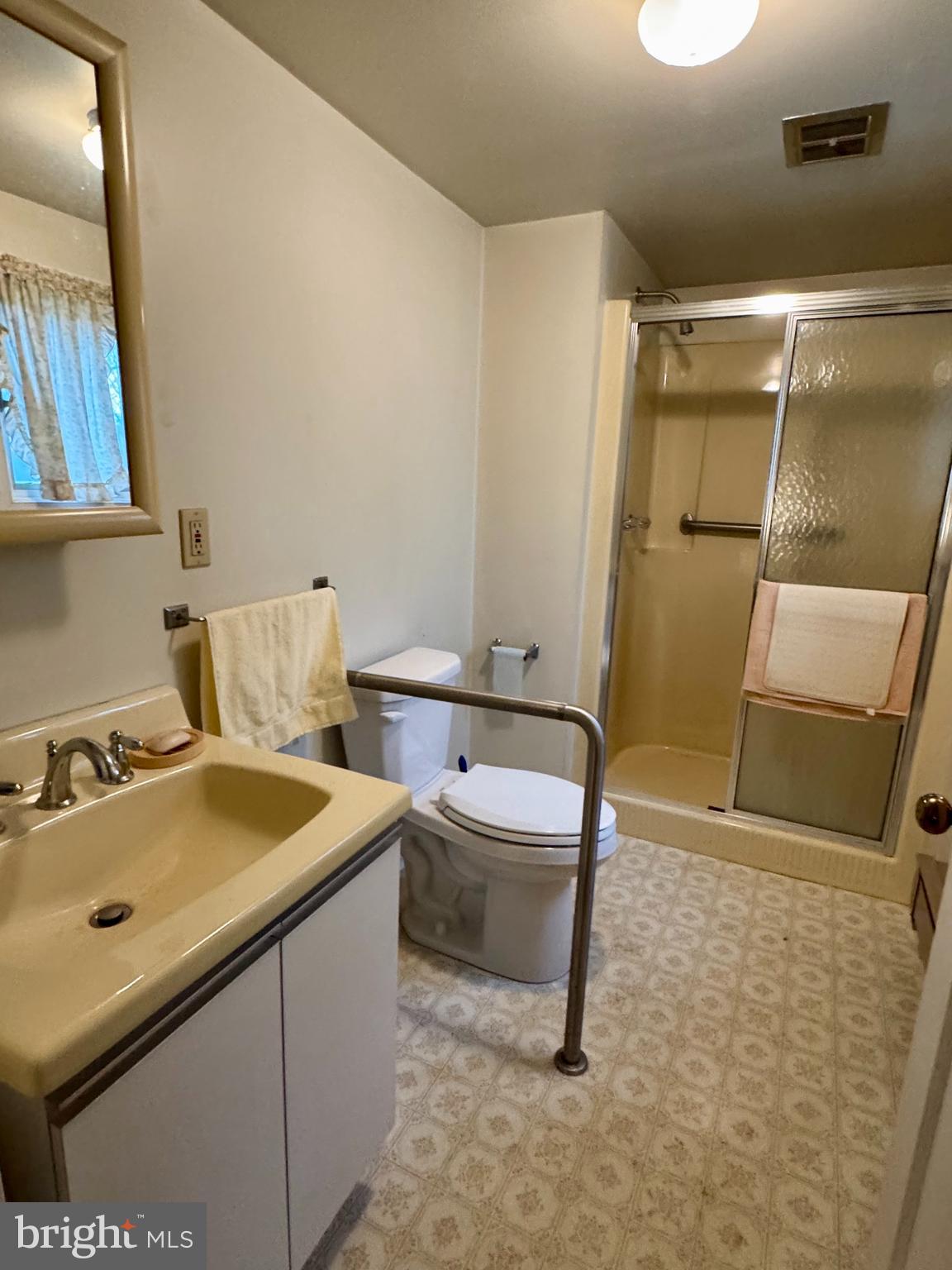 60 Hartford Road Delran, NJ 08075 - Photo 11 of 16 a bathroom with a sink a toilet and mirror