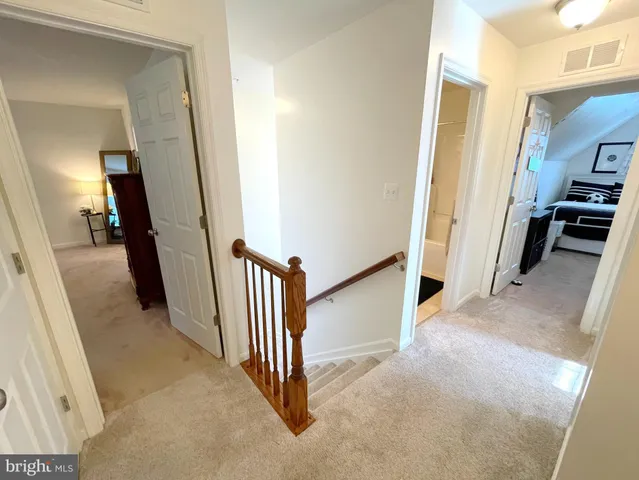 a large kitchen with a counter top appliances and cabinets