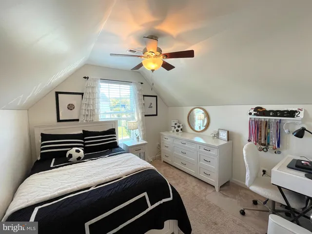 a living room with fireplace furniture and a flat screen tv
