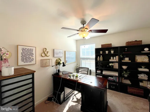 a view of a hallway with entryway and stairs