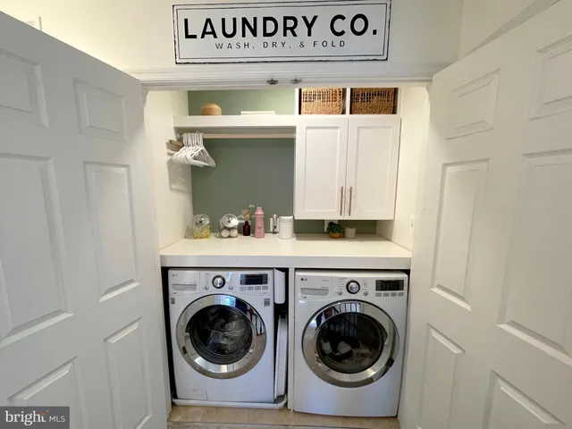 a bathroom with a sink vanity granite toilet and a mirror