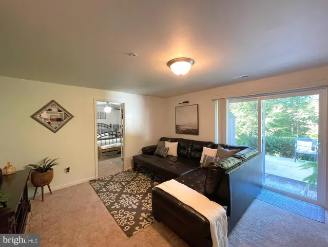 a bath tub sitting in a bathroom next to a window