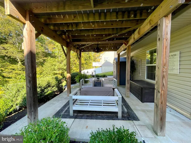 a view of a patio with wooden floor