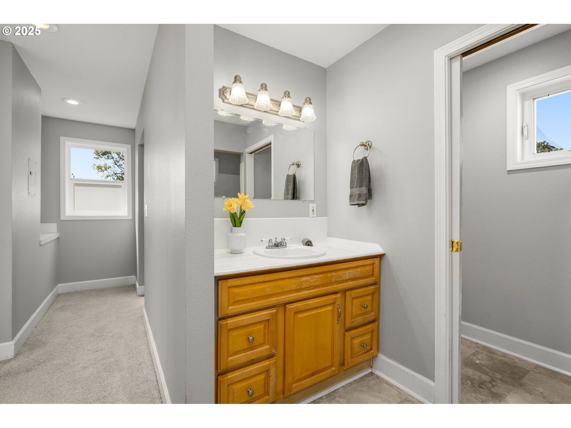 13120 Southwest Rita Drive Beaverton, OR 97005 - Photo 11 of 27 a bathroom with a sink vanity and mirror