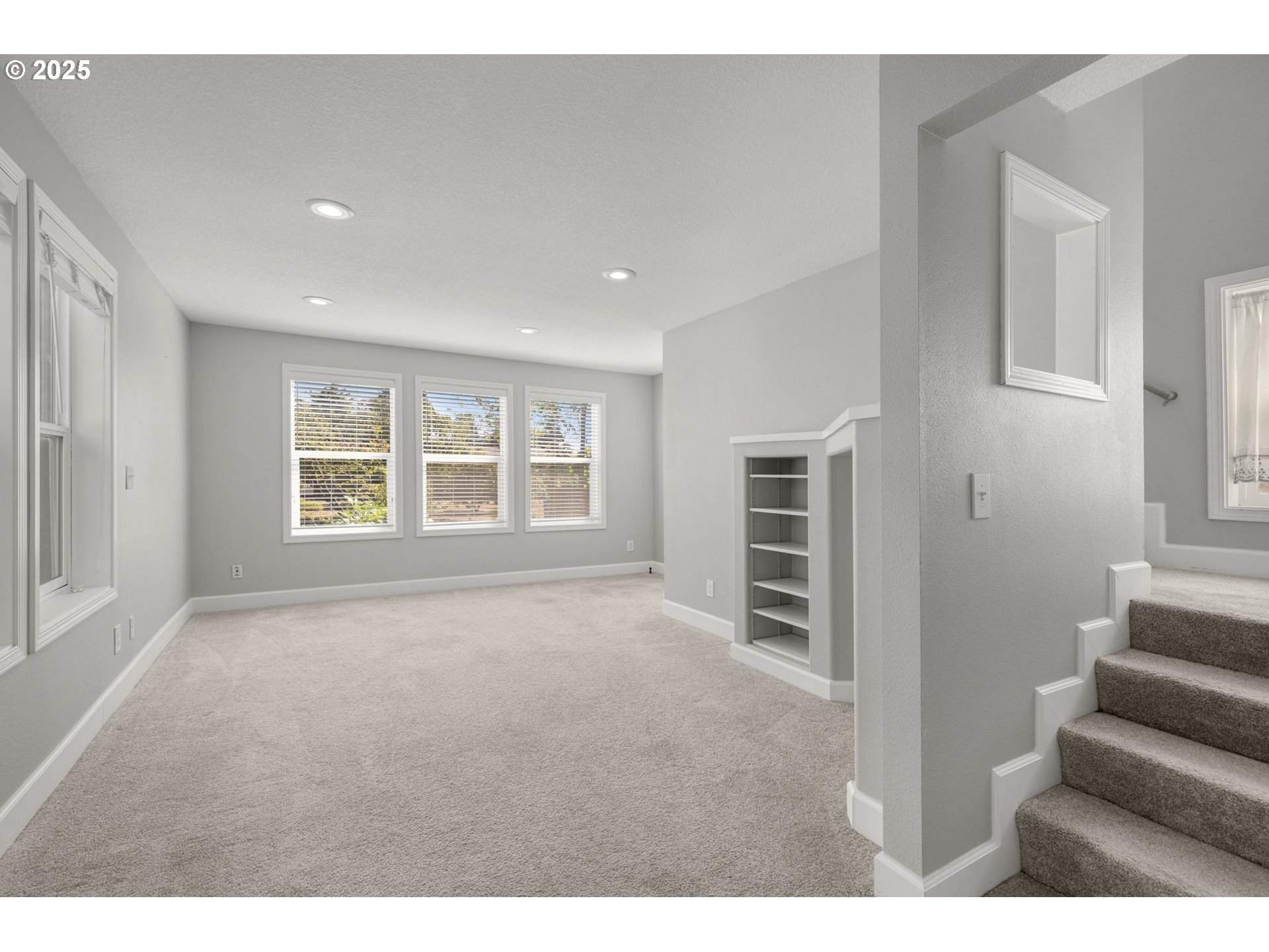 13120 Southwest Rita Drive Beaverton, OR 97005 - Photo 13 of 27 a view of an empty room with stairs and windows