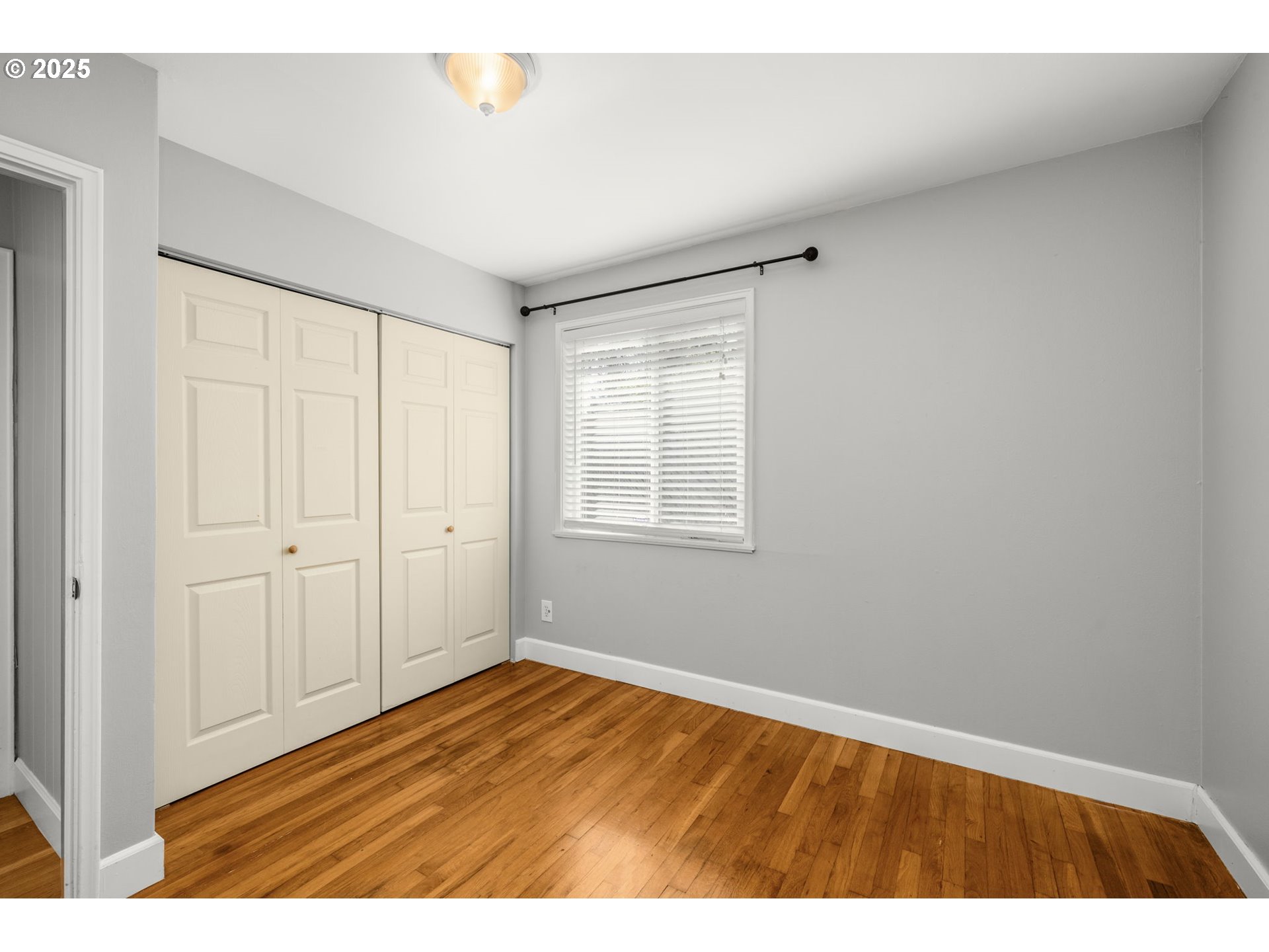 13120 Southwest Rita Drive Beaverton, OR 97005 - Photo 18 of 27 a view of an empty room with wooden floor