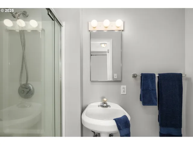 a bathroom with a sink vanity and a mirror