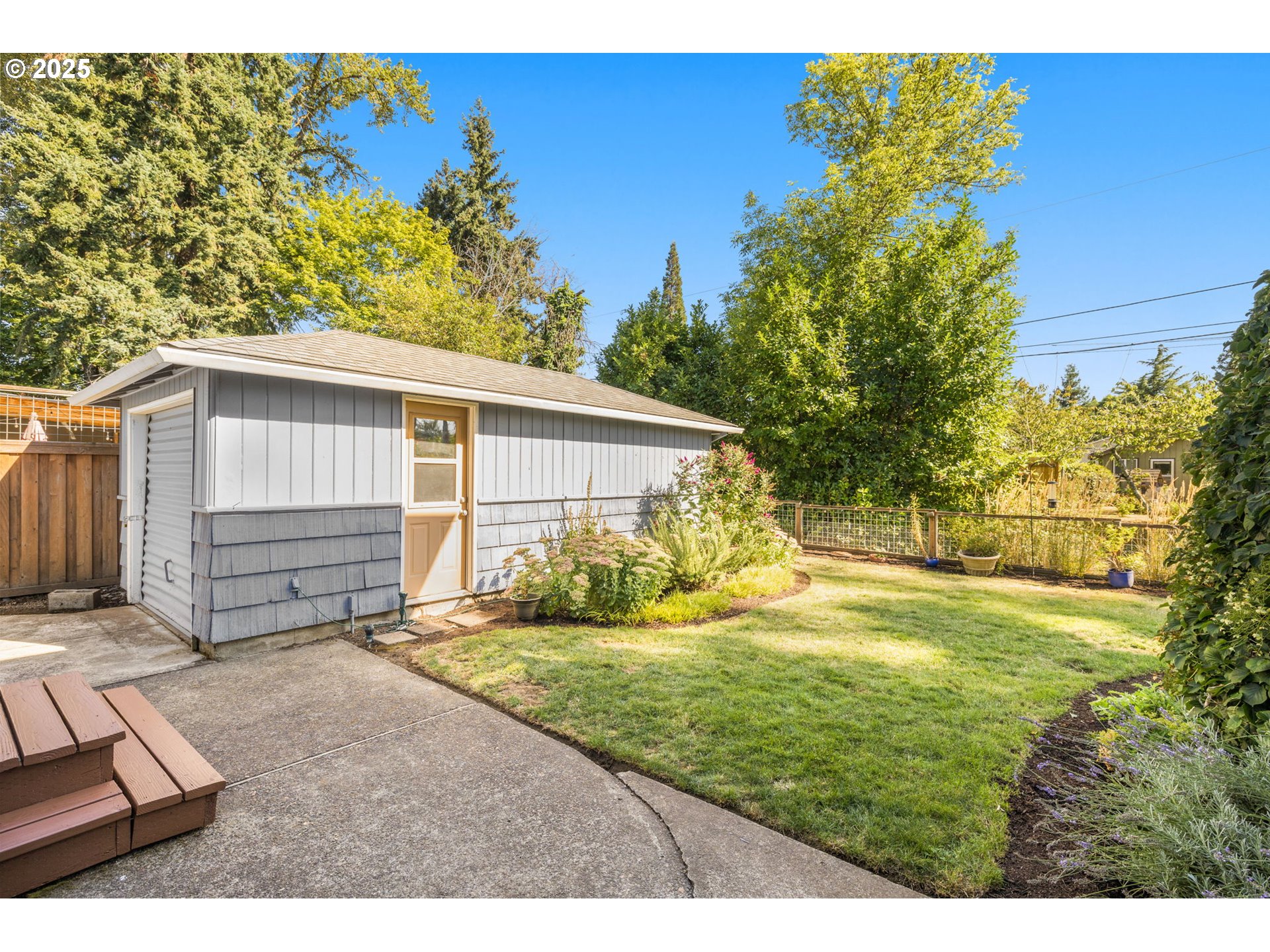 13120 Southwest Rita Drive Beaverton, OR 97005 - Photo 23 of 27 a view of a backyard with plants and a patio