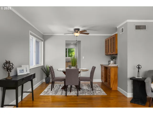 a dining room with furniture and window