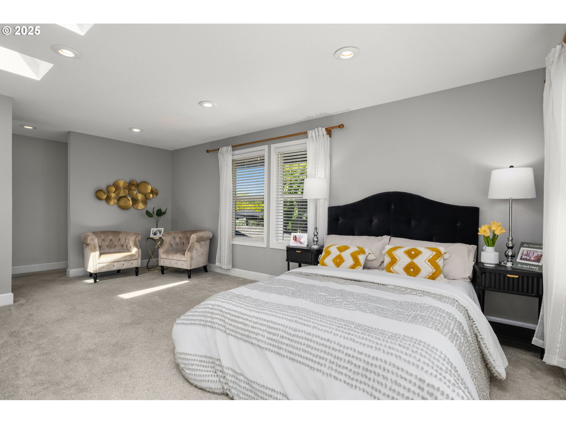 13120 Southwest Rita Drive Beaverton, OR 97005 - Photo 9 of 27 a bedroom with a bed and a large window