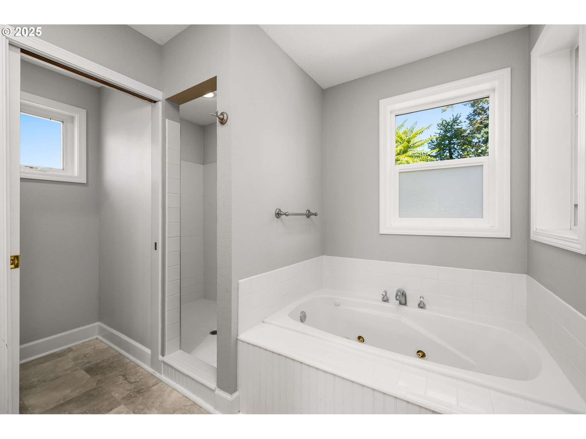13120 Southwest Rita Drive Beaverton, OR 97005 - Photo 10 of 27 a white bath tub sitting next to a window